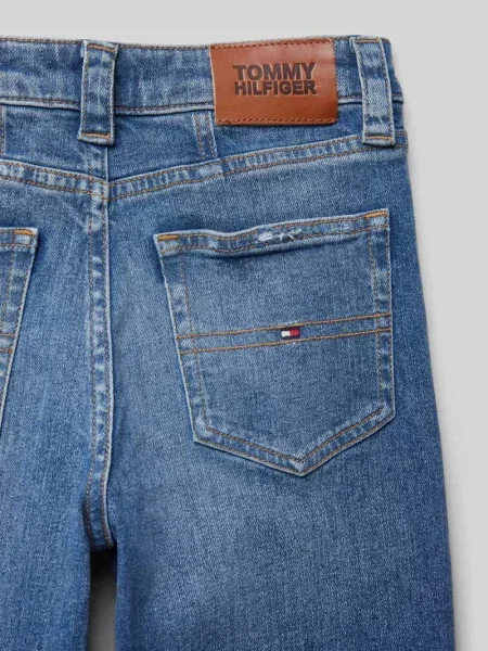 Jeansy z efektem znoszenia model ‘GIRLFRIEND’ Tommy Hilfiger Teens niebieskie