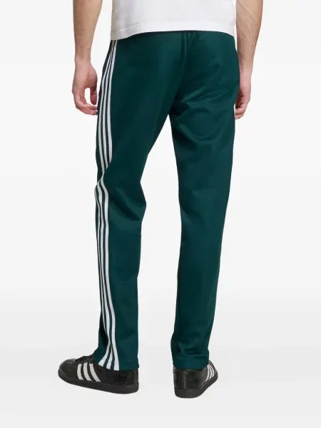 Pruhované kalhoty Adidas zelené