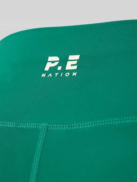 Legginsy o kroju slim fit z nadrukiem logo model Dynamic' P.e Nation zielone