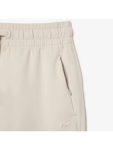 Зауженные спортивные штаны Lacoste красные