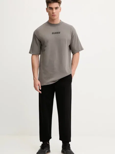 Спортивні штани Guess FINLO з аплікацією чорний