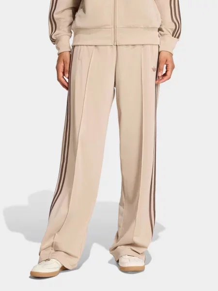 Спортивні штани adidas FIREBIRD LOOSE TRACK поліетилентерефталат коричневий