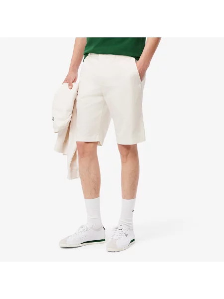 Сhinosy Lacoste białe