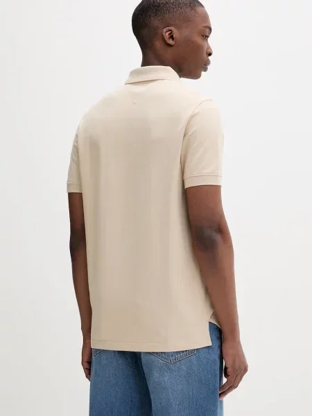 Koszulka polo Regular Fit z czystej bawełny Tommy Jeans beżowa