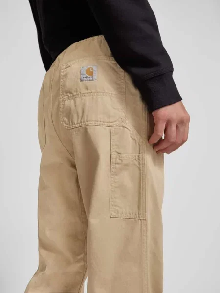 Spodnie o kroju regular fit z bocznymi wpuszczanymi model ‘FLINT’ Carhartt Work In Progress beżowe