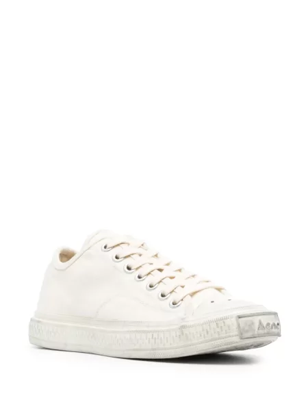 Sportbačiai Acne Studios su nubrozdinimais balta