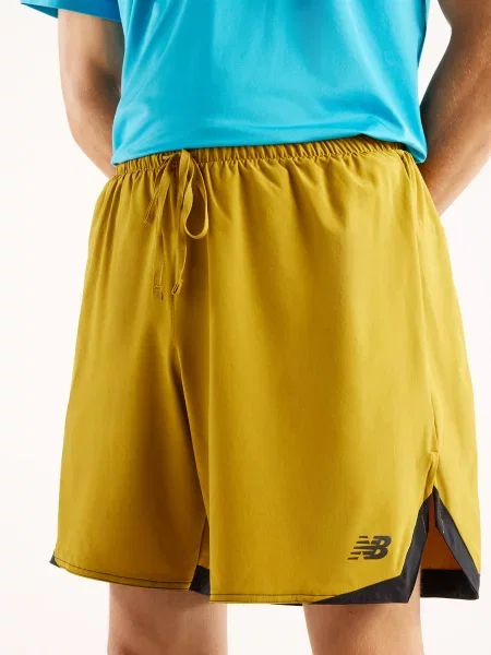 Спортивные шорты New Balance желтые