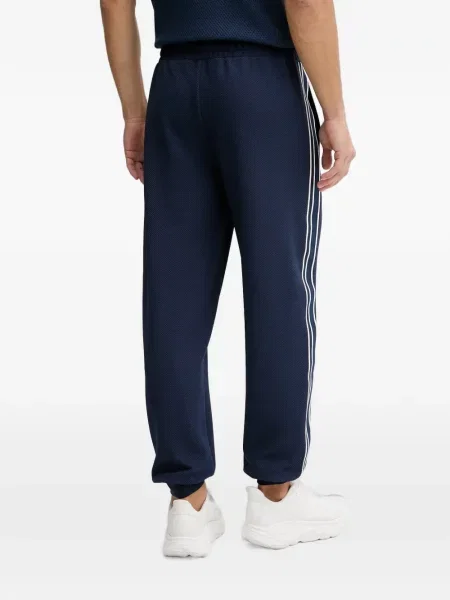 Pantaloni Guess cu dungi alergare albastru