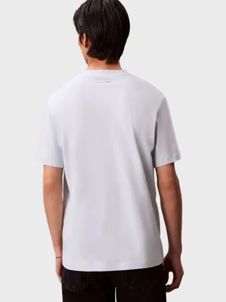 Графічний футболка Calvin Klein Jeans блакитна