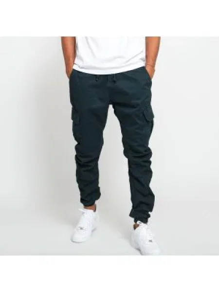 Běžecké tepláky Urban Classics zelené