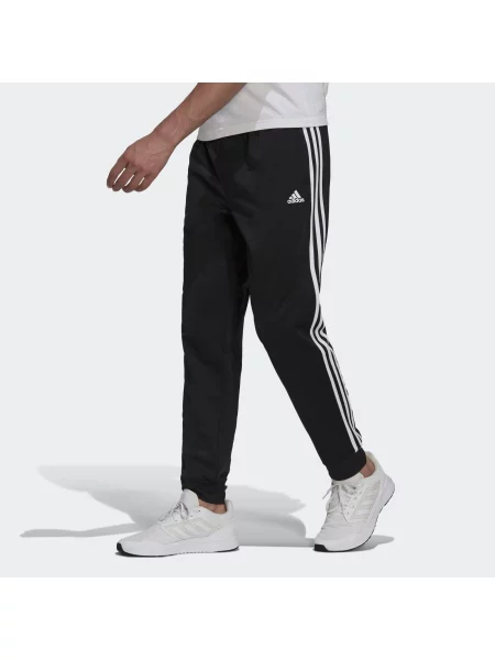 Spodnie dresowe adidas Primegreen Essentials Warm-Up zwężane białe