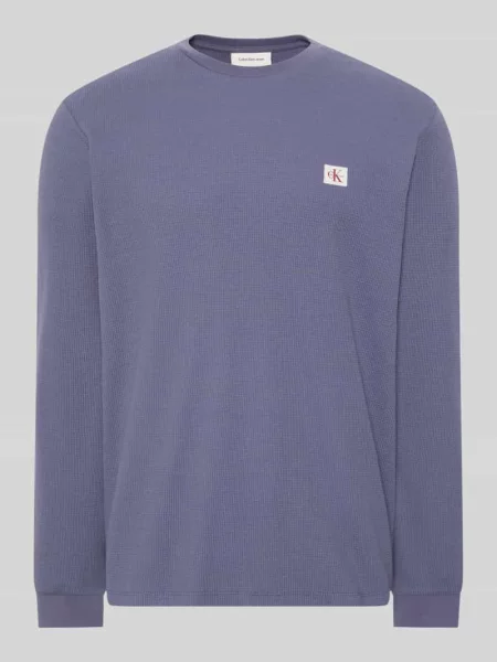 Bluzka z długim rękawem o kroju regular fit z mieszanki bawełny Calvin Klein Jeans niebieska
