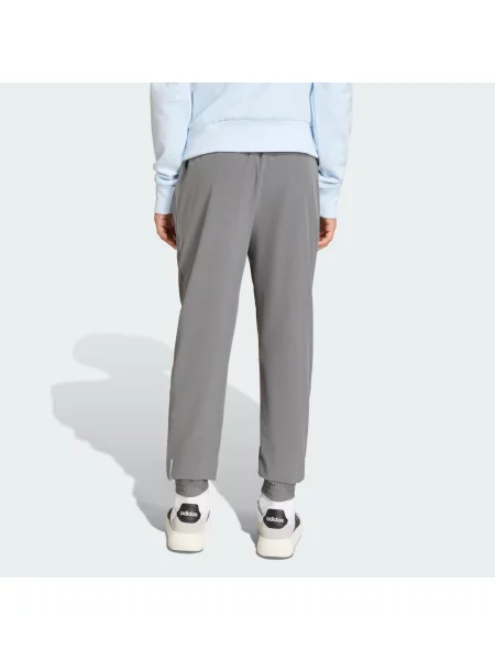 KALHOTY ADIDAS BOYS HOODED TECH WOVEN šedé