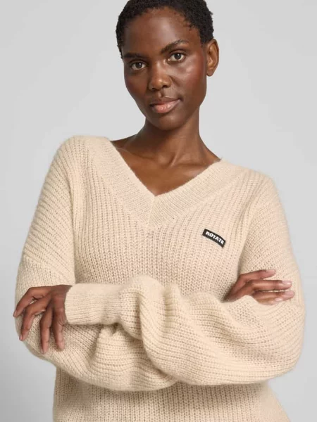 Sweter o kroju oversized z dodatkiem wełny Rotate beżowy