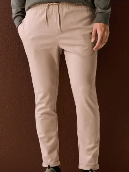 Sinsay Spodnie dresowe jogger z domieszką beżowy