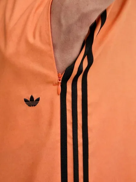Спортивні штани adidas Originals Adilenium візерунок помаранчевий