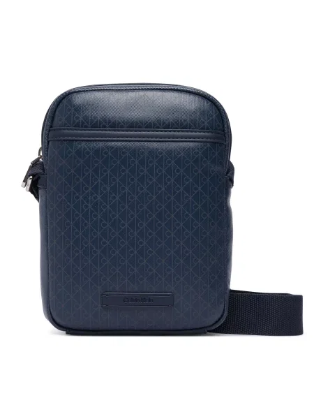 Calvin Klein Válltáska Emblem Aop Coated Slim Reporter Sötétkék