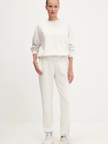 Спортивні штани Guess ROBERTA з аплікацією бежевий