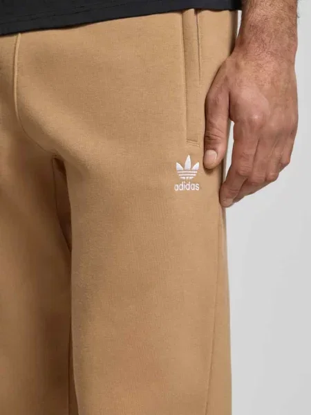 Spodnie dresowe z elastycznym ściągaczem Adidas Originals beżowy