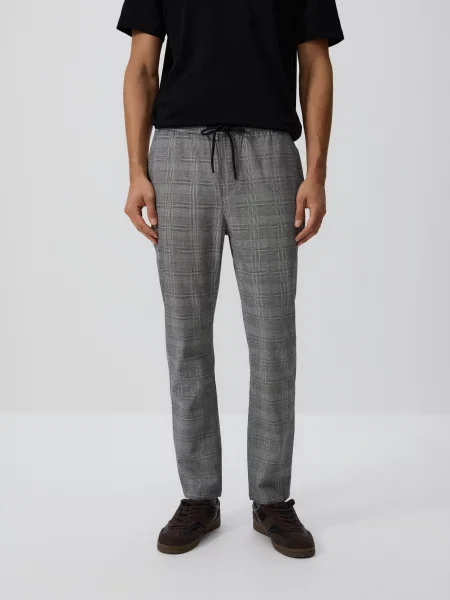 Клетчатые брюки Reserved серые