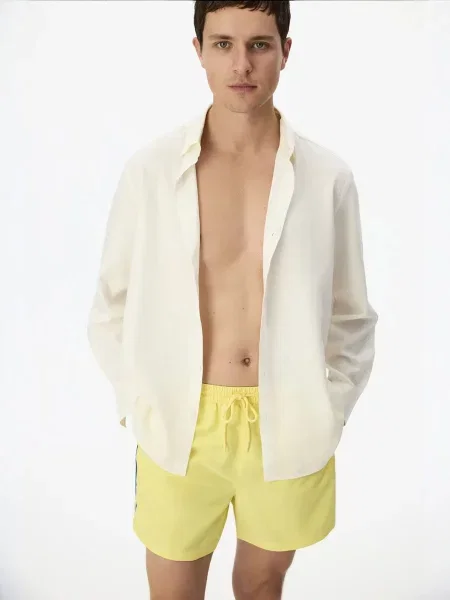Penti Plavecké šortky PENTI Herren Badeshorts Opposite Line citronově žlutá
