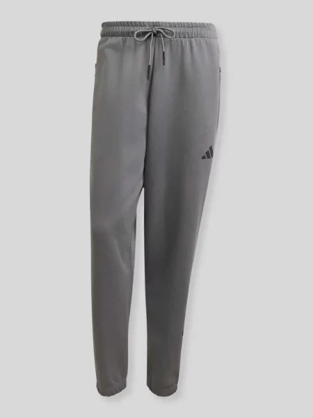 Spodnie dresowe o kroju regular fit z domieszką bawełny Adidas Sportswear