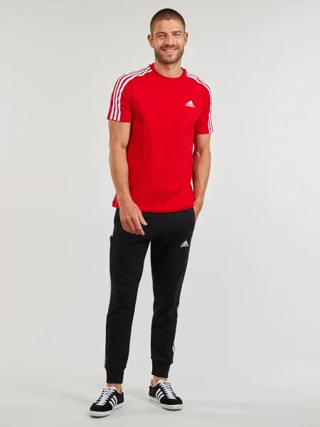 Csíkos frottír melegítőnadrág Adidas Sportswear fekete