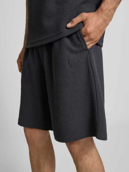 Szorty o kroju relaxed fit z fakturowanym wzorem Karl Kani czarne