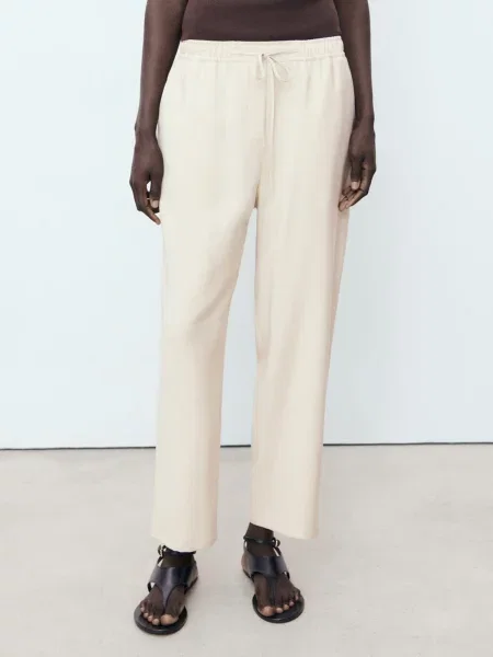 MANGO Pantaloni FLUIDO deschis bej
