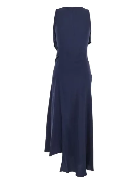 Rochie Victoria Beckham drapată de costum albastru