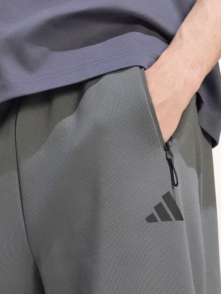 Teplákové kalhoty adidas šedé