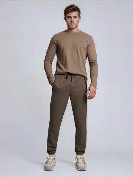 Sinsay Spodnie dresowe jogger brązowy