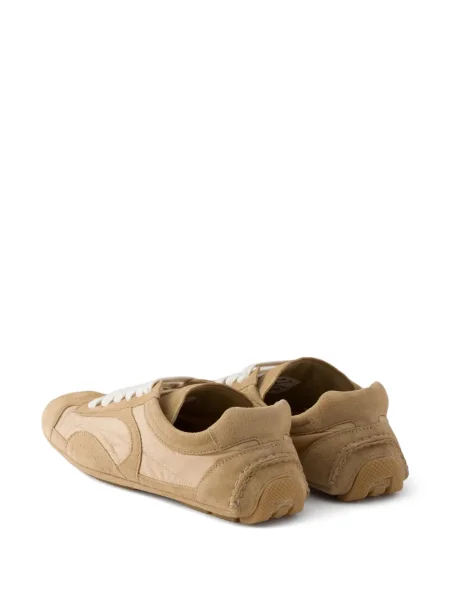 Sneakerși Prada din dantelă
