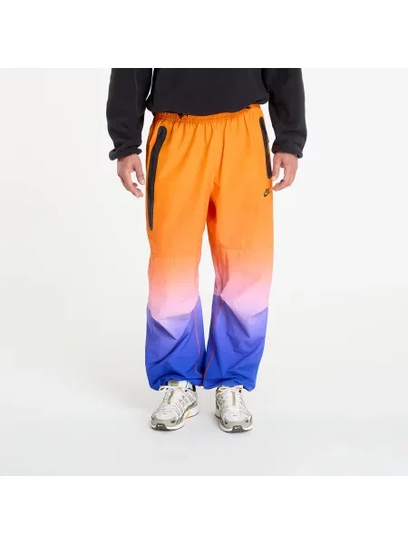 Reflexní kalhoty Nike oranžové