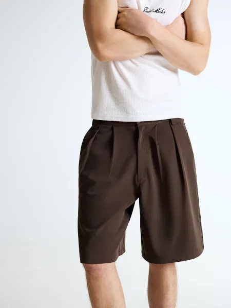 Bershka Pantaloni cutați închis maro
