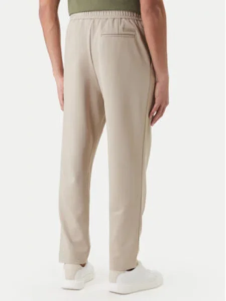 Calvin Klein Szövet nadrág Tapered Fit bézs