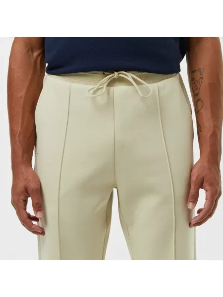 Lacoste Spodnie Dresowe Relaxed Fit beżowe