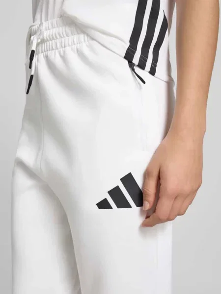Spodnie dresowe z elastycznym pasem i tunelem Adidas Sportswear biały