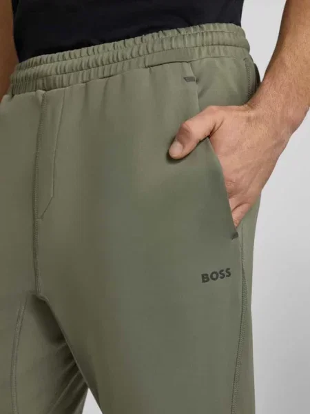 Spodnie dresowe o kroju regular fit z szybkoschnącego materiału model „HICON ACTIVE” Boss Green