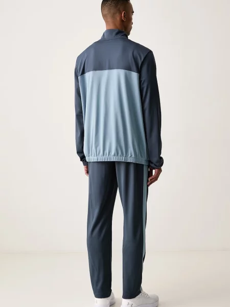 Under Armour komplet dresowy EMEA niebieski