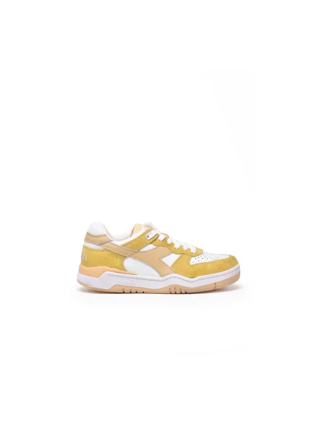 Sneakersy Diadora skórzane z przetarciami żółte