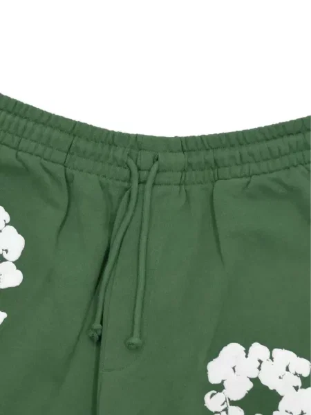 Pantaloni Denim Tears cu model floral cu imagine verde