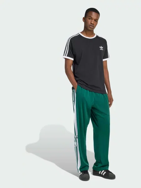 Повседневные переработанный брюки Adidas зеленые