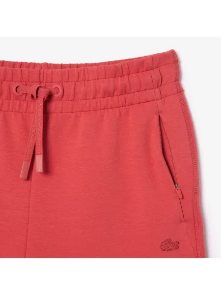 Зауженные спортивные штаны Lacoste розовые