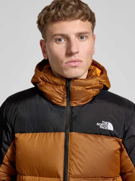 Kurtka puchowa z wyhaftowanym logo The North Face pomarańczowa