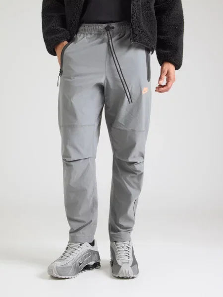 Nike Sportswear Nohavice / oranžová sivá
