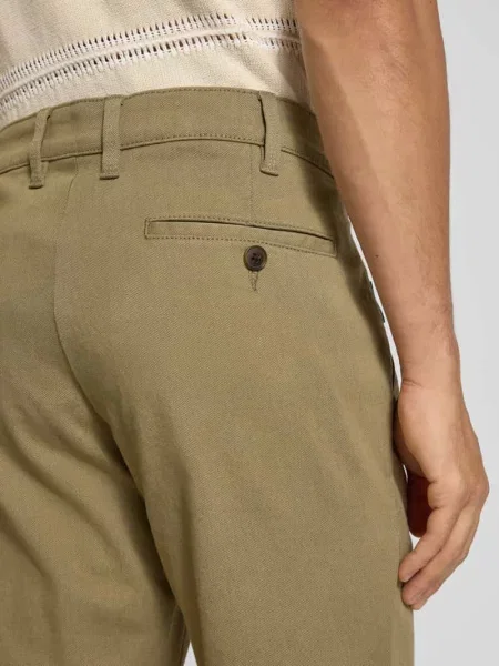 Spodnie o kroju regular fit z wpuszczanymi Christian Berg Men