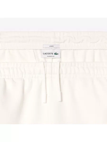 Lacoste Spodnie Dresowe Ze Zwężanymi Nogawkami niebieskie