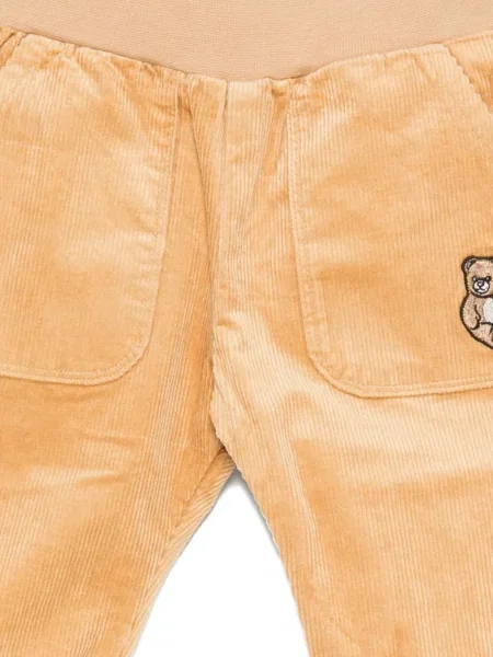 Spodnie dziecięce Moschino pomarańczowe