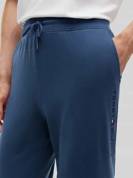 Spodnie dresowe o kroju regular fit z czystej bawełny z napisem z logo Tommy Hilfiger niebieskie
